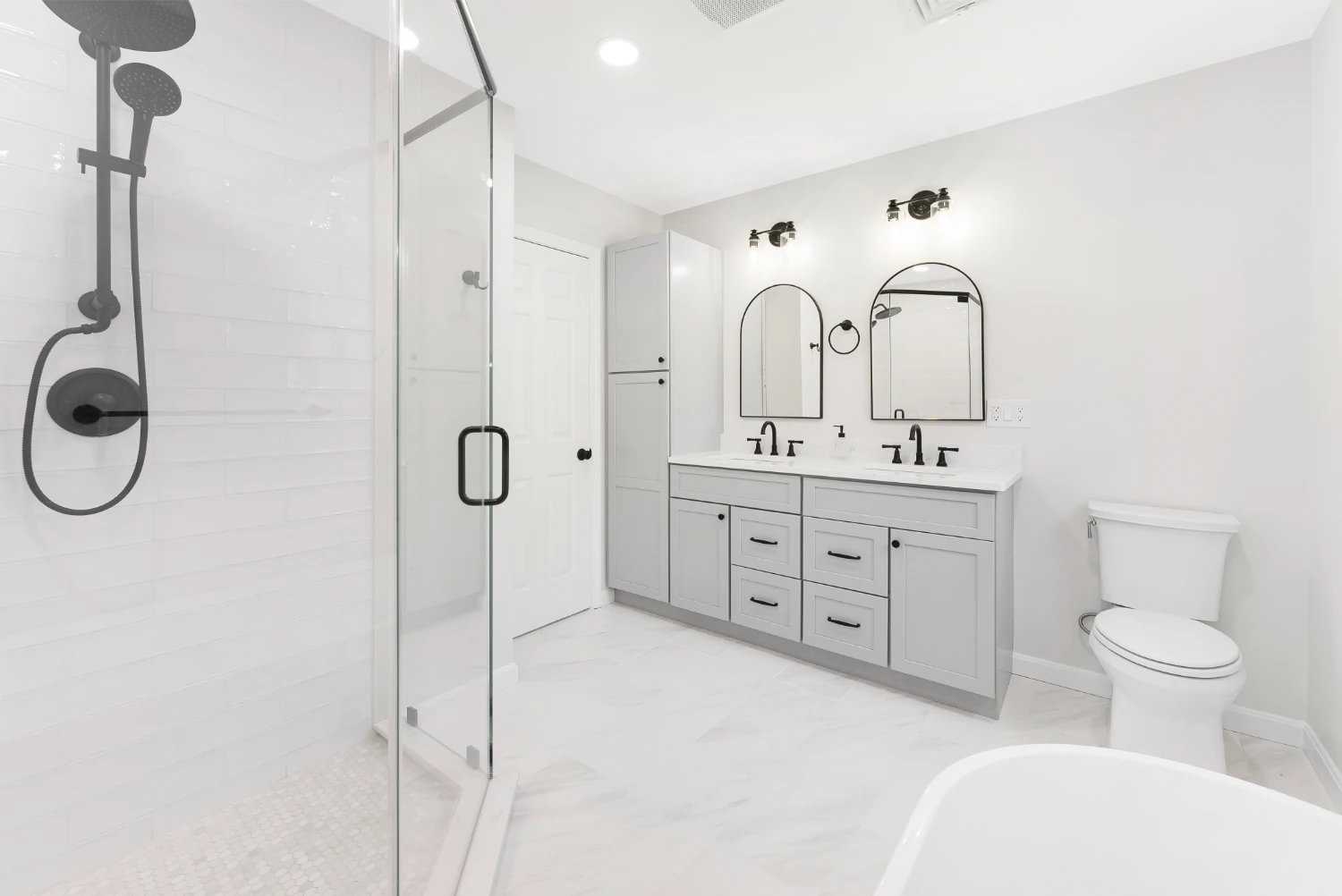 remodeled bathroom vanity with all white and gray